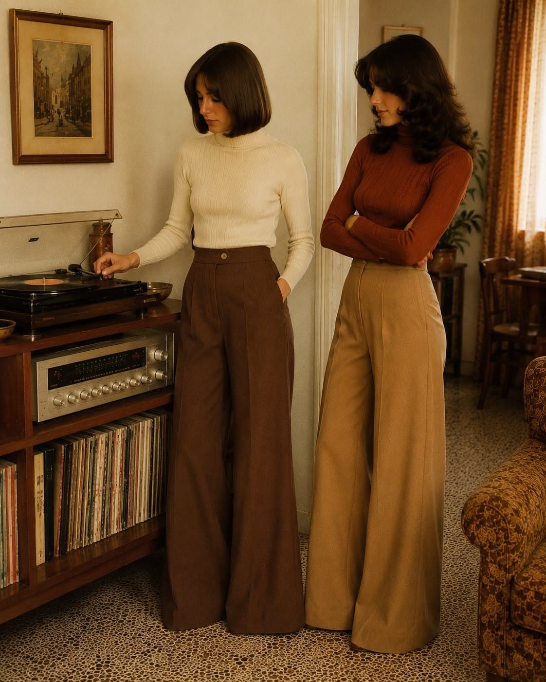 Two women wearing vintage high-waisted wide-leg trousers and turtlenecks standing near a record player.